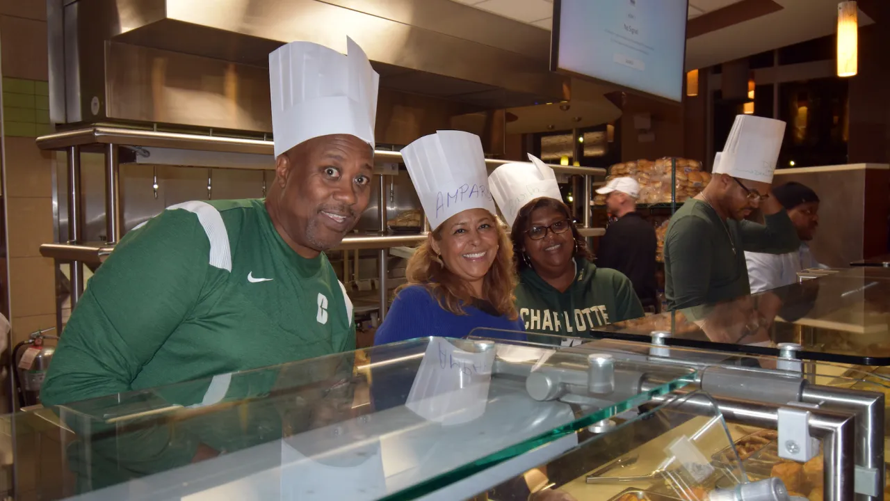 University employees serving Late Night Breakfast