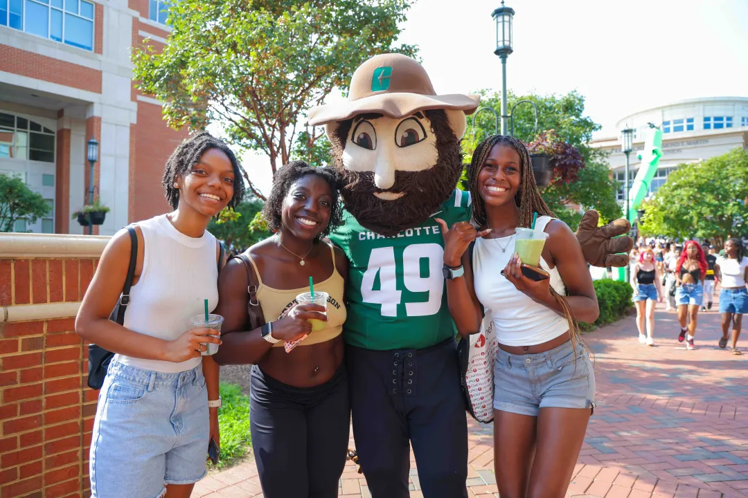 Students smiling with Norm at the Student Orgs Showcase